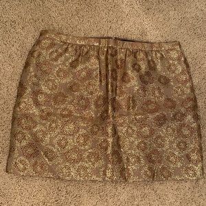 J. Crew shiny gold skirt size 4 with circular designs on skirt